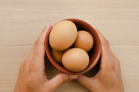 Fresh, nutritious brown chicken eggs in a bowl on the table, waiting to be used.