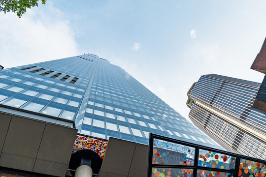 View of the Leadenhall Building with its glass facade and distinctive tapered shape against a clear blue sky in London, England, United Kingdom.