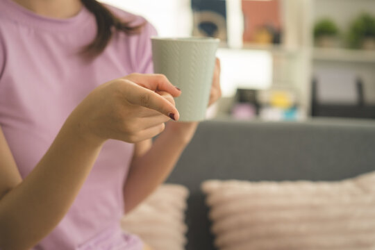 Young Asian Woman Working Online, Relaxing and Practicing Self Care During Daily Life at Home