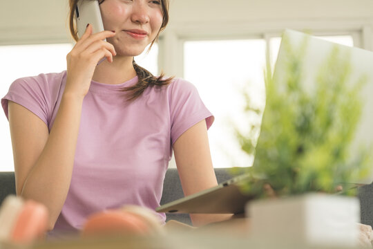 Young Asian Woman Working Online, Relaxing and Practicing Self Care During Daily Life at Home