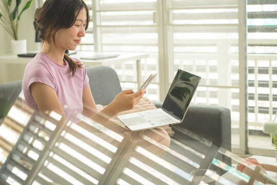 Young Asian Woman Working Online, Relaxing and Practicing Self Care During Daily Life at Home