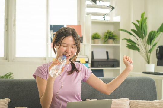 Young Asian Woman Working Online, Relaxing and Practicing Self Care During Daily Life at Home
