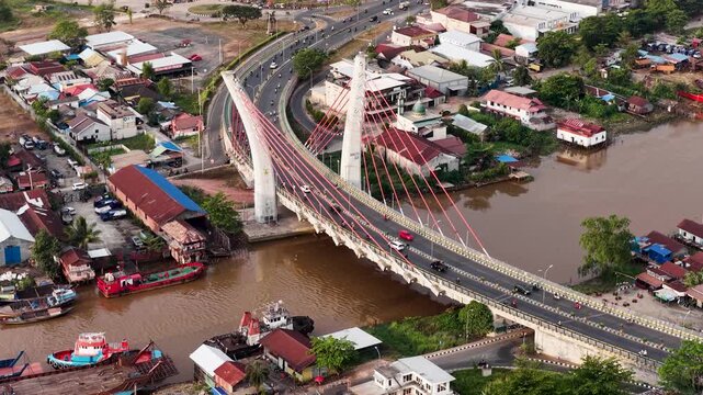 A view of Banjarmasin city and the Alalak River Bridge (or Basit Handil Bakti Bridge) in the late afternoon