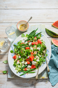 Summer salad with watermelon - feta - beans - cucumber - pinenuts and olive oil