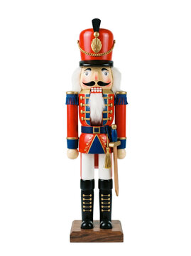 Isolated festive wooden nutcracker soldier with white beard wearing red jacket and high hat for holiday ornament collection