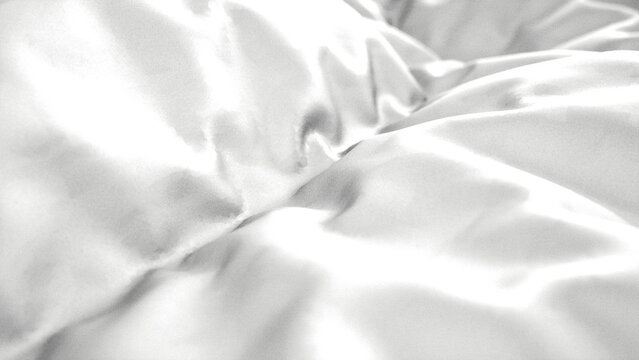 Abstract white silk fabric texture with soft folds and smooth flowing waves background