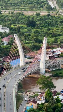 A view of Banjarmasin city and the Alalak River Bridge (or Basit Handil Bakti Bridge) in the late afternoon