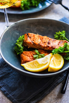 Grilled salmon steak with lemon