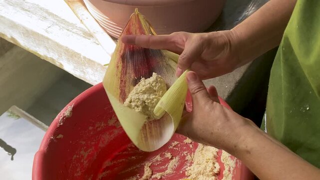 Woman Making Traditional Tamales