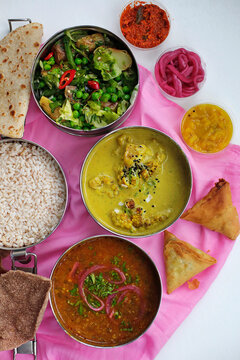 Cauliflower curry with salad and rice