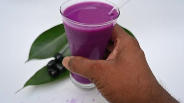 Syzygium cumini fruits juice. Its other names is Malabar plum, Java plum, black plum, jamun and jambolan. This fruit has anti diabetic properties. Indian jamun juice. Healthy drink. Fruit juice. 