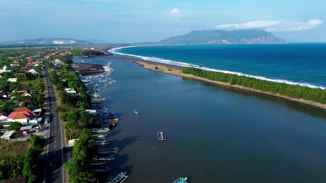 Puger, East Java, Indonesia. A Sweeping Landscape of a Bay Enveloped in Aerial Panning