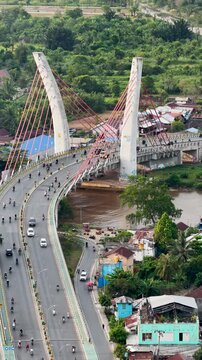 A view of Banjarmasin city and the Alalak River Bridge (or Basit Handil Bakti Bridge) in the late afternoon