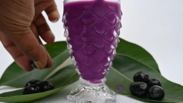 Syzygium cumini fruits juice. Its other names is Malabar plum, Java plum, black plum, jamun and jambolan. This fruit has anti diabetic properties. Indian jamun juice. Healthy drink. Fruit juice. 