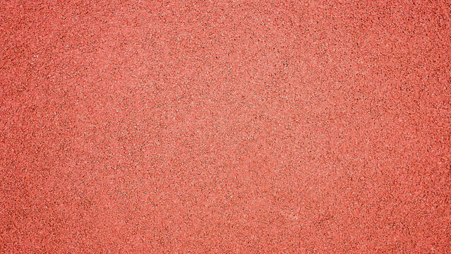 Red synthetic rubber running track surface