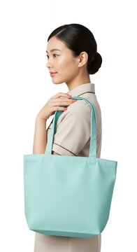 Young Asian Woman with Mint Green Tote Bag Posing Sideways.