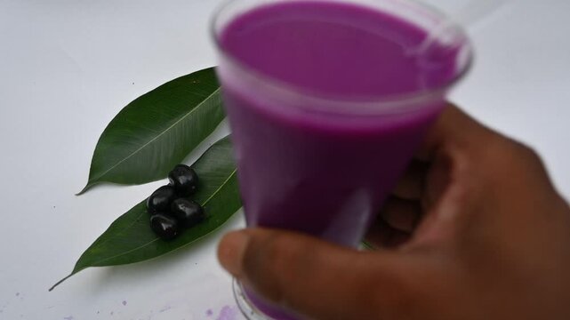 Syzygium cumini fruits juice. Its other names is Malabar plum, Java plum, black plum, jamun and jambolan. This fruit has anti diabetic properties. Indian jamun juice. Healthy drink. Fruit juice. 