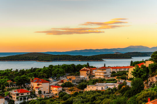 Hvar town and Pakleni Islands viewed from the medieval Spanish Fortress, golden hour over the Adriatic sea, Croatia.