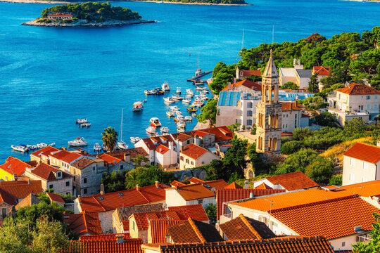 Hvar town and Pakleni Islands viewed from the medieval Spanish Fortress, golden hour over the Adriatic sea, Croatia.