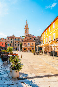Jelsa town on Hvar island, with traditional Dalmatian stone architecture and boats moored in the harbor, Croatia.