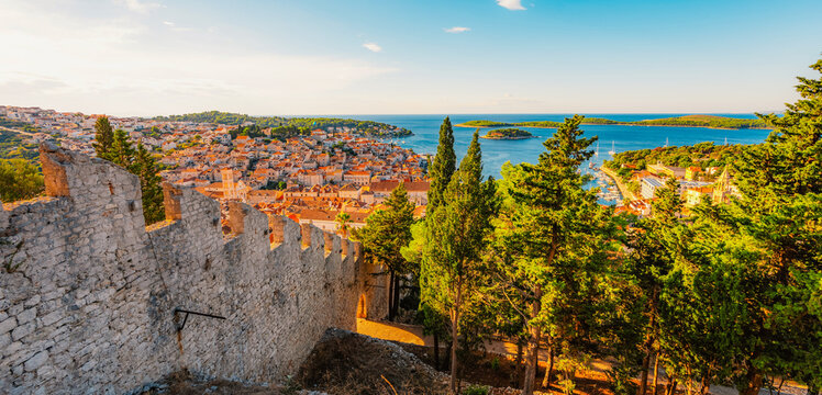 Hvar town and Pakleni Islands viewed from the medieval Spanish Fortress, golden hour over the Adriatic sea, Croatia.