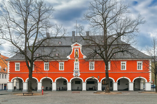 Town hall in Soest, Germany, front view. Historic baroque palace style architecture under cloudy winter sky without snow.