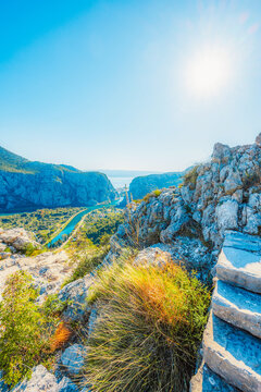 Omis town and the Cetina river canyon from the Adriatic coastal highway, scenic bay and mountains in Dalmatia, Croatia.