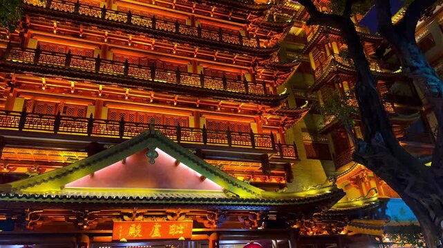 Night view of Guangzhou Dafo Temple, also known as Big Buddha Temple, located on Beijing Road, Guangzhou, China. The historic temple features traditional Chinese architecture, ornate roofs