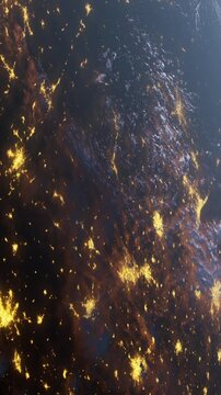 Bright city lights across the Earth at night. The dark surface of the planet contrasts with the glowing areas where people live.