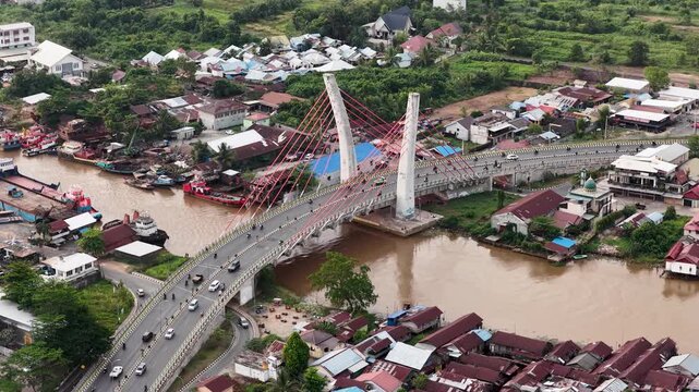 A view of Banjarmasin city and the Alalak River Bridge (or Basit Handil Bakti Bridge) in the late afternoon