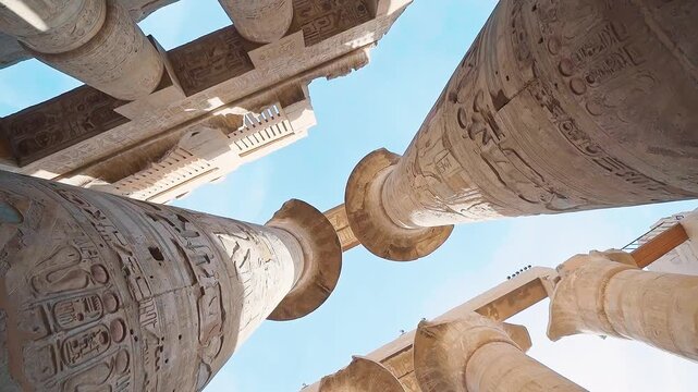 Pillars of the majestic temple of Karnak in Luxor, Egypt. Karnak Temple is dedicated to the temple complex of Ancient Egypt in honor of the god Amun-Ra, his wife Mut and son Khons. Thebes, Karnak.