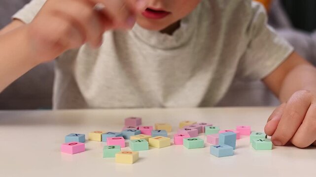 Focused Little Boy Solving Simple Addition with Colorful Math Blocks at Home, Early Childhood Education, STEM Learning, Homeschooling, Cognitive Development, Learning Through Play