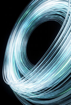 Circular 3D fiber loop glowing against darkness