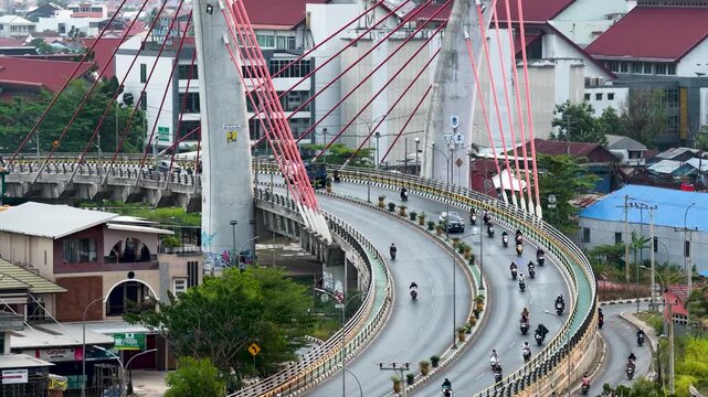 A view of Banjarmasin city and the Alalak River Bridge (or Basit Handil Bakti Bridge) in the late afternoon