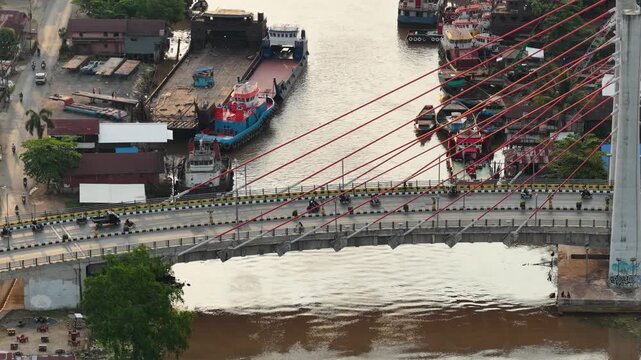A view of Banjarmasin city and the Alalak River Bridge (or Basit Handil Bakti Bridge) in the late afternoon
