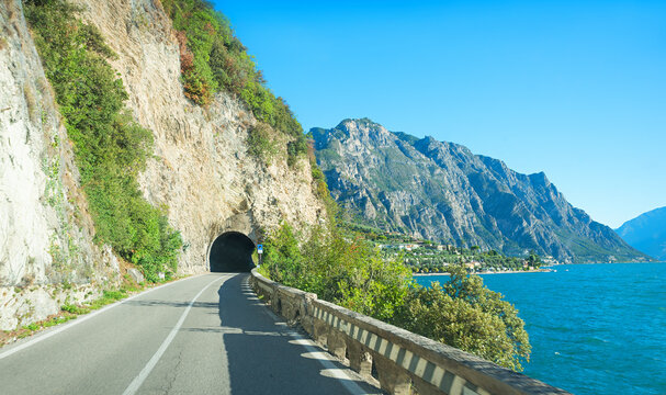 driving at Gardesana occidentale, lakeside road Gardasee, with many tunnels