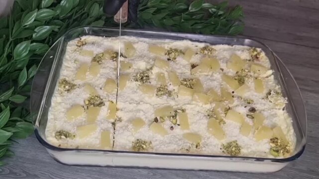 Slicing and Serving Pineapple Cake with Spatula from Glass Dish