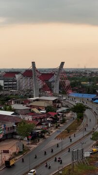 A view of Banjarmasin city and the Alalak River Bridge (or Basit Handil Bakti Bridge) in the late afternoon