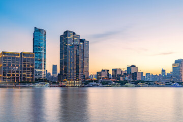 Fototapeta premium Modern urban architecture, road traffic, and Huangpu River night view in Lujiazui, Pudong, Shanghai, China