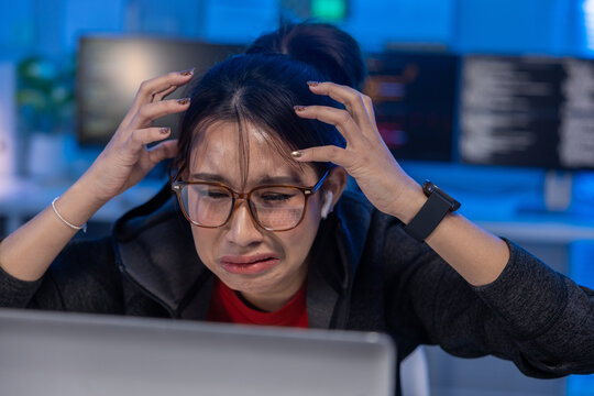 Woman stress laptop office computer glasses anxiety work technology problem, woman wearing glasses feeling stress laptop blue office, anxious expression with hand head during computer work