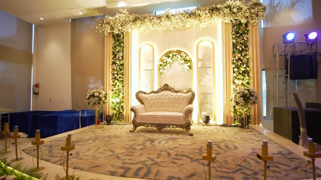 Elegant wedding stage decoration with floral backdrop and luxury sofa for Indian ceremonies