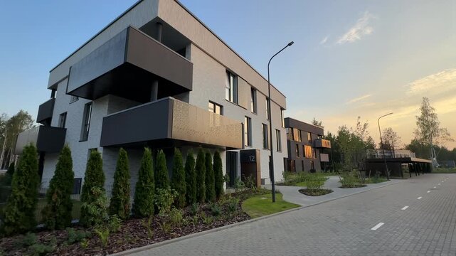 Landscaping. Landscape design of courtyard. Modern contemporary apartment building. Premium urban villa development. City apartment in unique multi-family house in gated community. Suburb apartments 