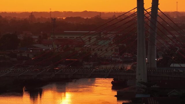 A view of Banjarmasin city and the Alalak River Bridge (or Basit Handil Bakti Bridge) in the sunset