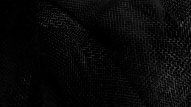 Abstract black mesh background with fine synthetic net texture