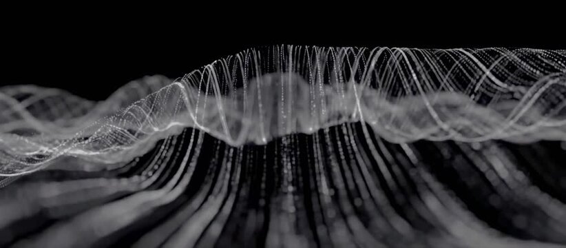 Animated flowing white particle lines form undulating wave patterns on a black background. Flowing visual background for digital media and technology presentations.