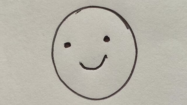 Close up of hand drawn different human emotion or mood like happy smiley face and sad unhappy face expression outline on white notebook paper. Depression, mental health, optimism and feelings concept.