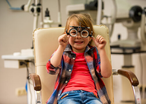 Child Wearing Trial Frames.