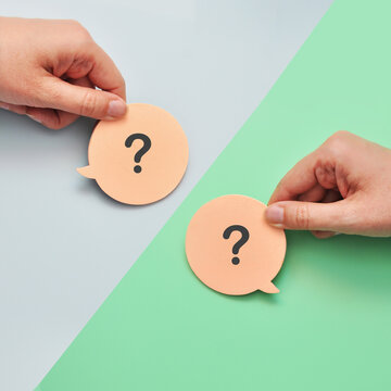 Two question mark speech bubbles. Uncertainty and communication between people