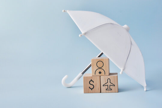 Umbrella protecting home, money and travel symbols. Insurance and financial security concept