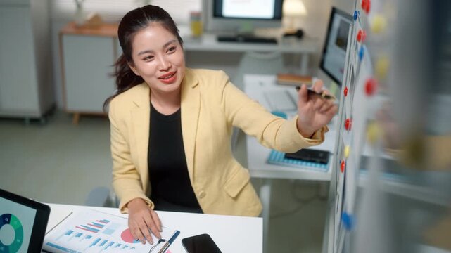 Smiling Businesswoman Planning Strategy in Modern Office